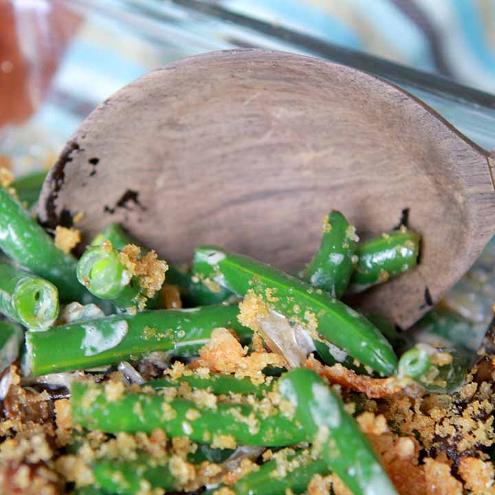 a spoon serves up Paleo green bean casserole