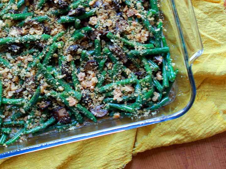 A pan of gluten free grain free green bean casserole against a yellow cloth napkin