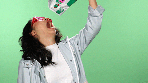 gif of a woman pouring a bag of potato chips into her mouth