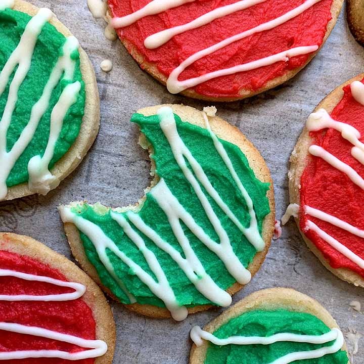 a top down view of red and green frosted gluten free Christmas cookies