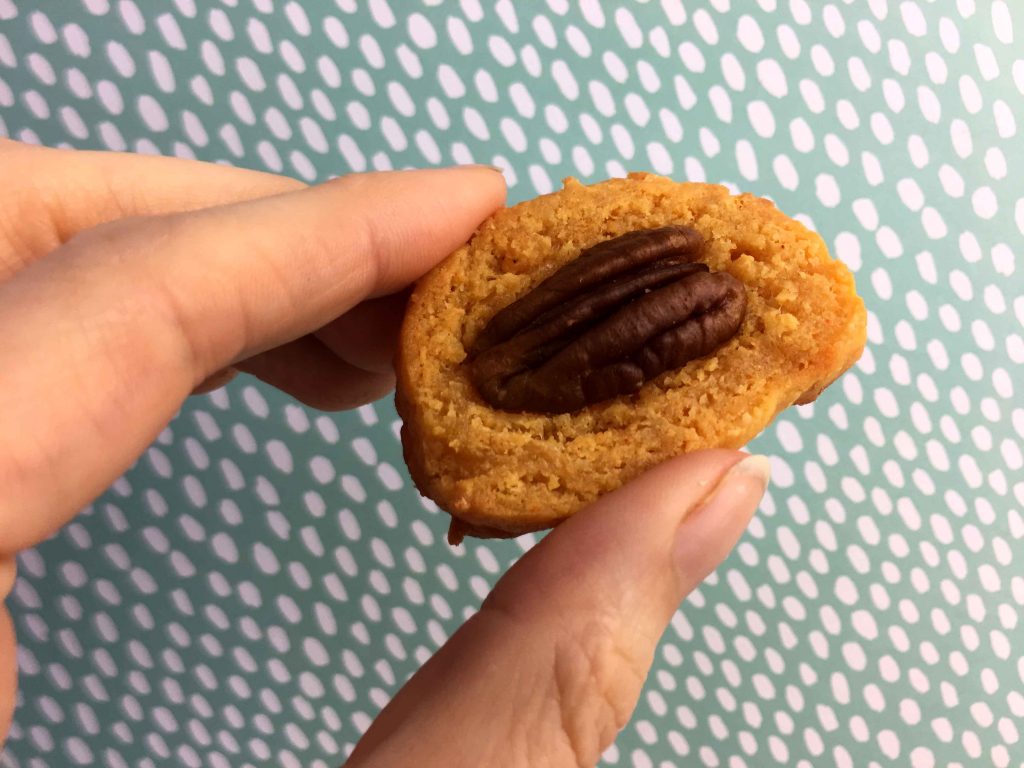 a hand holds a Keto almond flour cracker