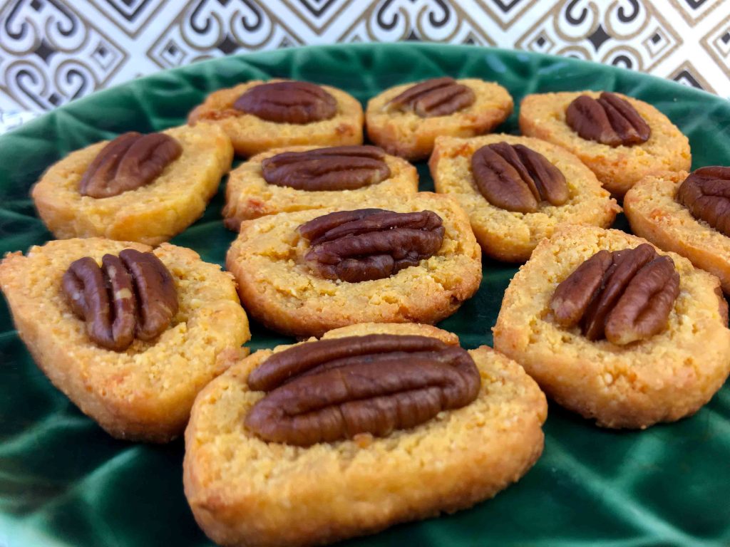 a green plate full of low carb almond flour crackers