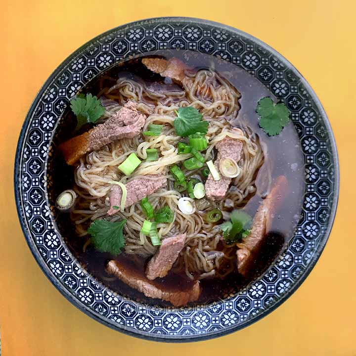 a top down view of a bowl of Keto Vietnamese noodle soup