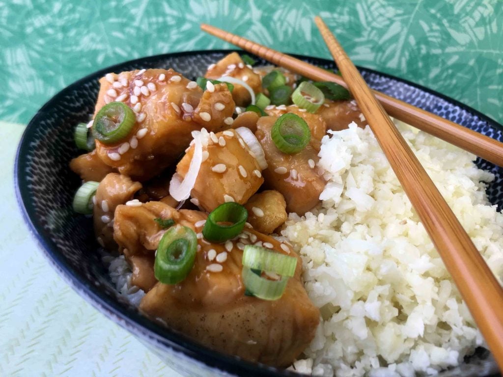 a bowl of Keto Sesame Chicken with Cauliflower Rice