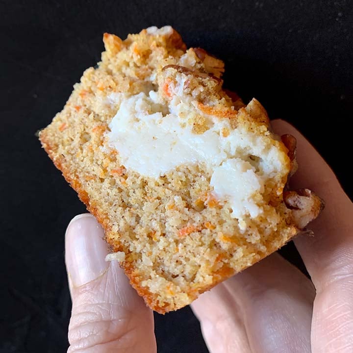 a hand holds a sugar-free carrot muffin