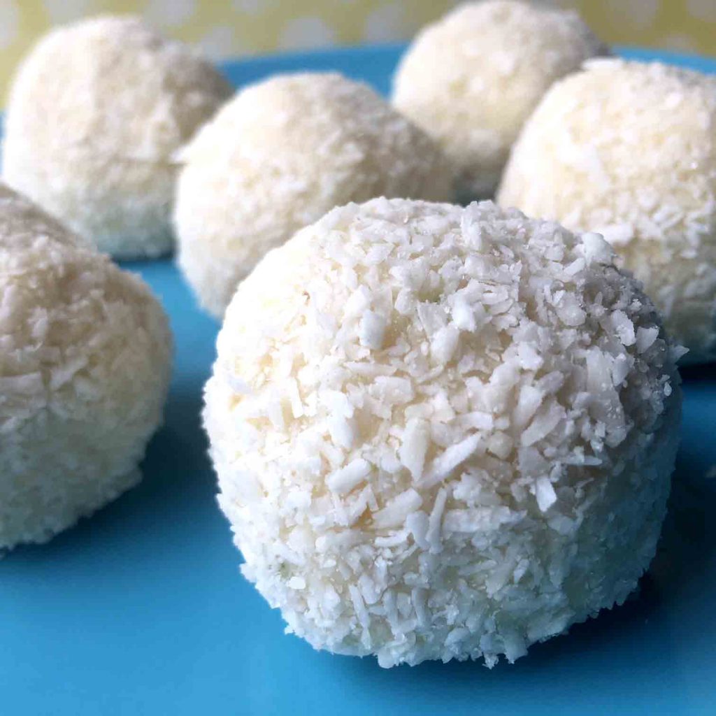 a plate of lemon Keto Cheesecake Balls