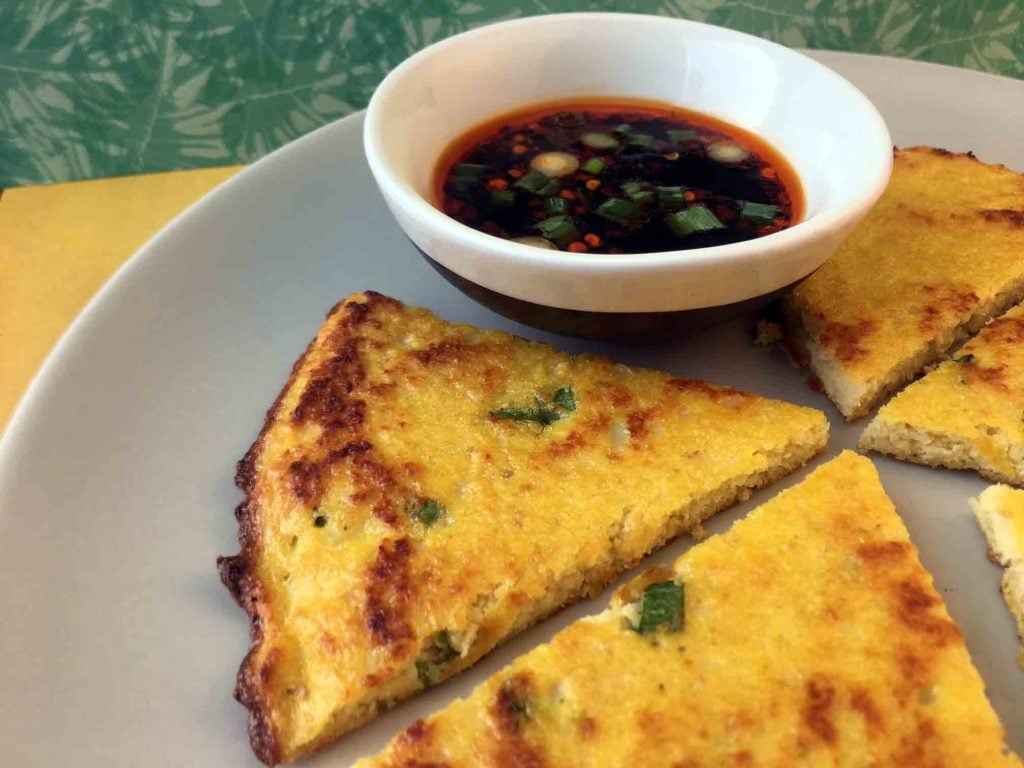 a plate of low carb Scallion Pancakes with a Chinese dipping sauce