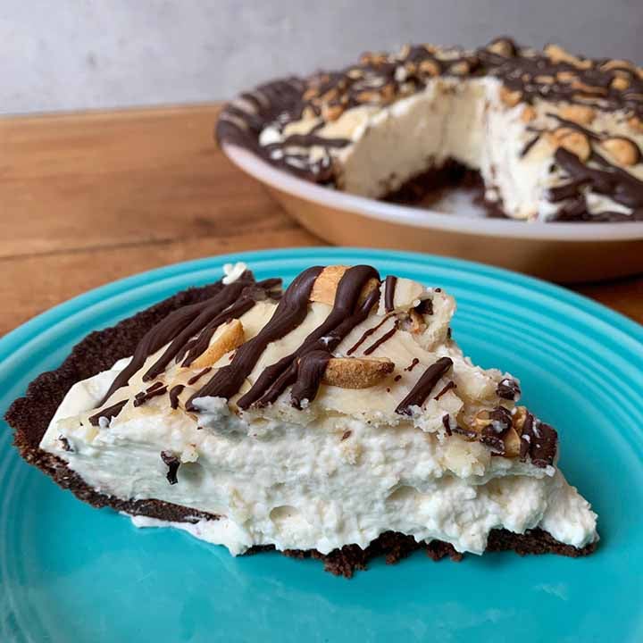 a slice of Keto Snickers Pie on a blue plate