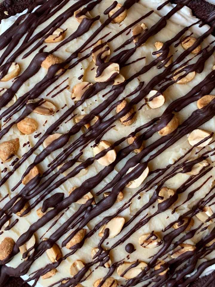 a close up of the surface of no-bake Snickers Pie