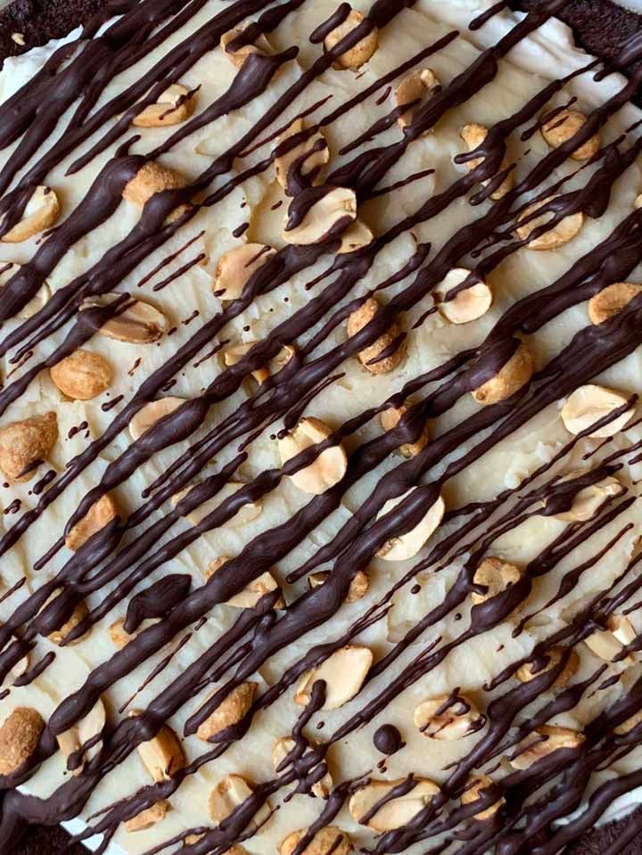 a close up of the surface of no-bake Snickers Pie
