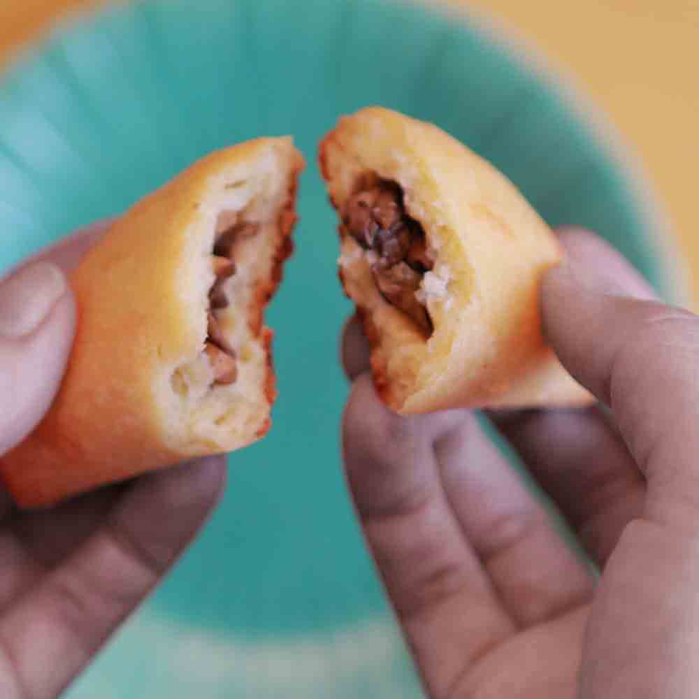 two hands hold a keto mushroom hot pocket