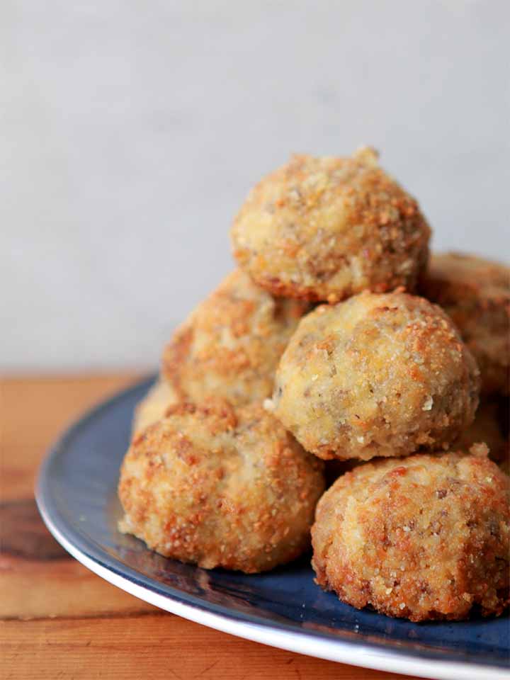 a pyramid made from Paleo sauerkraut balls against a gray background