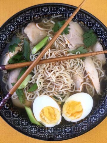 a bowl of Keto Chicken Ramen Soup with Shirataki Noodles