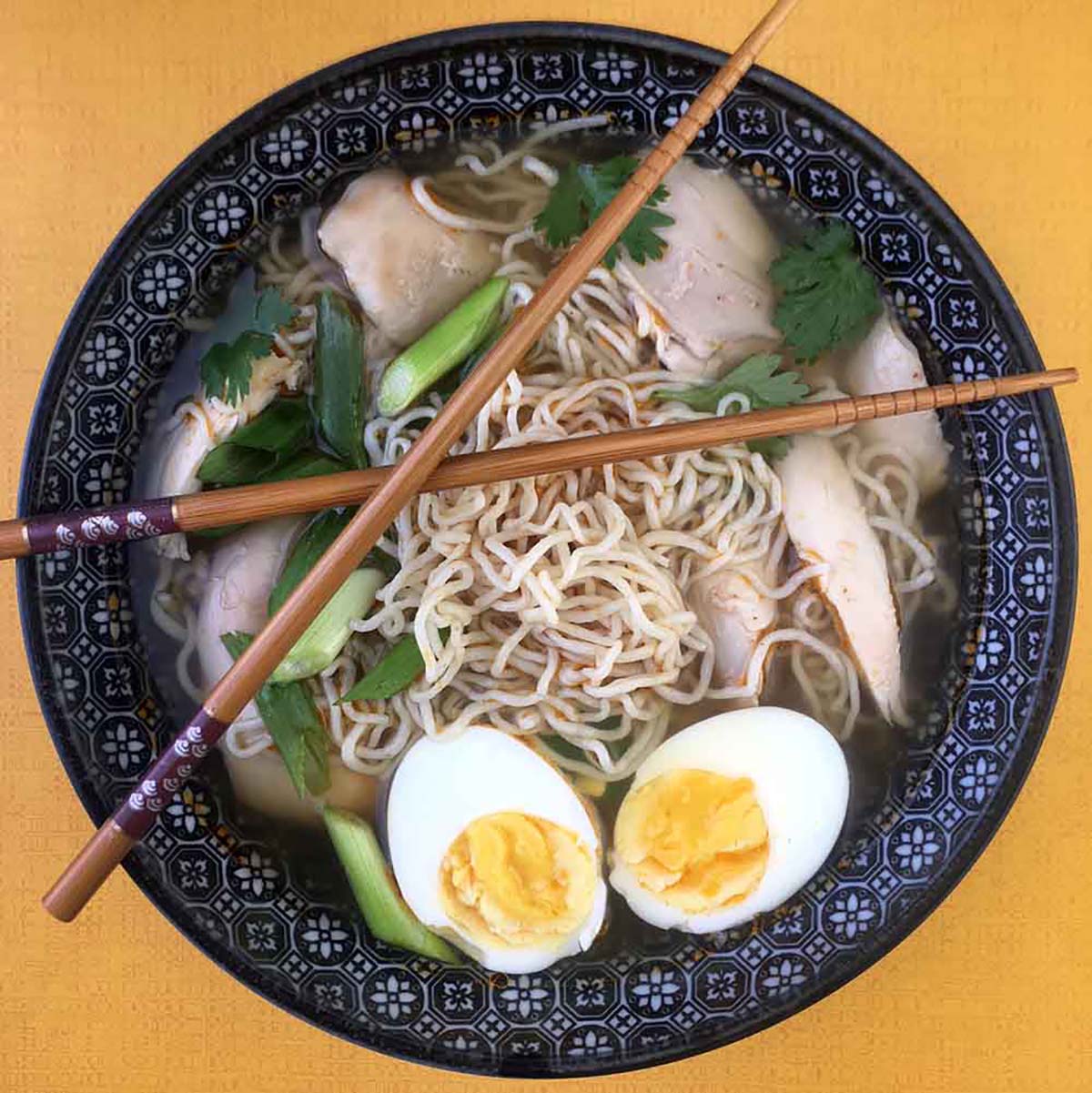 a bowl of Keto Ramen Soup with Shirataki Noodles and Chicken