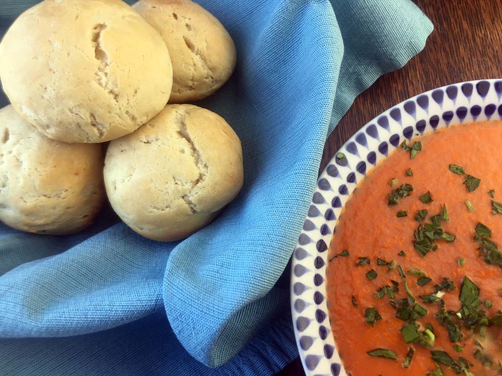 a bowl of Keto Dinner Rolls next to a bowl of soup