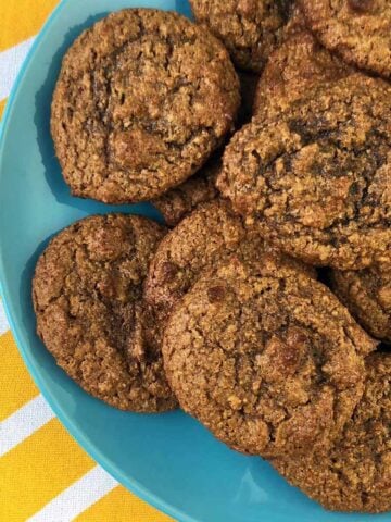 a top down view of a blue plate of low carb molasses ginger cookies
