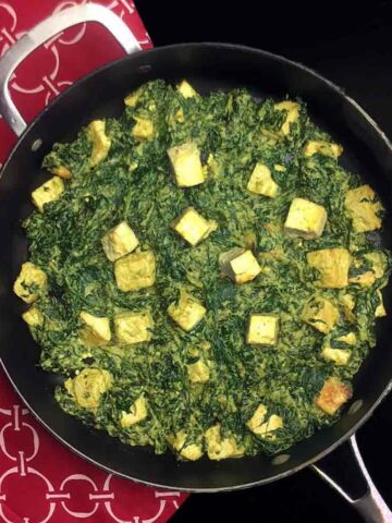 a wok full of Keto Saag Paneer with Tofu
