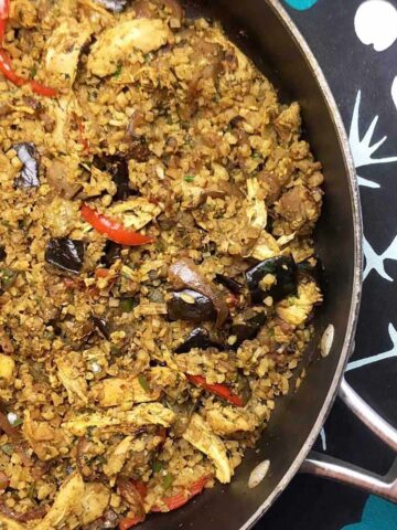 a wok filled with Chicken and Eggplant Biryani
