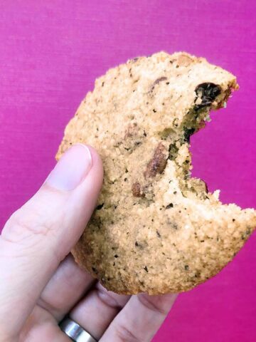 a hand holds a Keto Compost Cookie