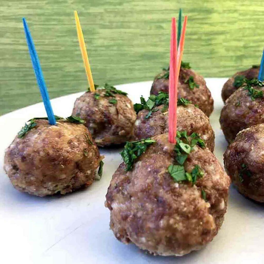 a plate of Greek Lamb Meatballs with Tzatziki Sauce