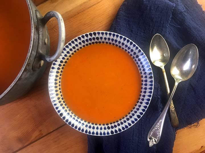 a top down view of a bowl of vegetarian tomato soup