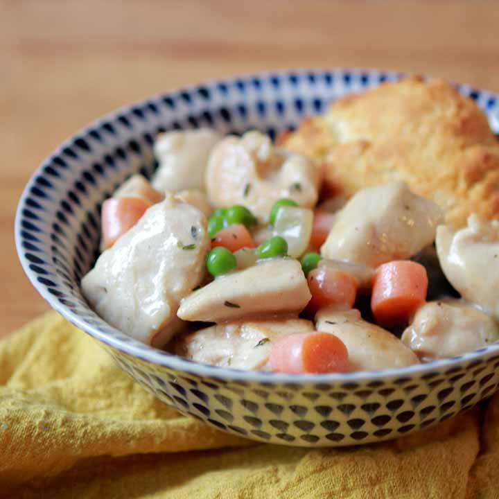 A side view of a patterned bowl holding low carb chicken pot pie