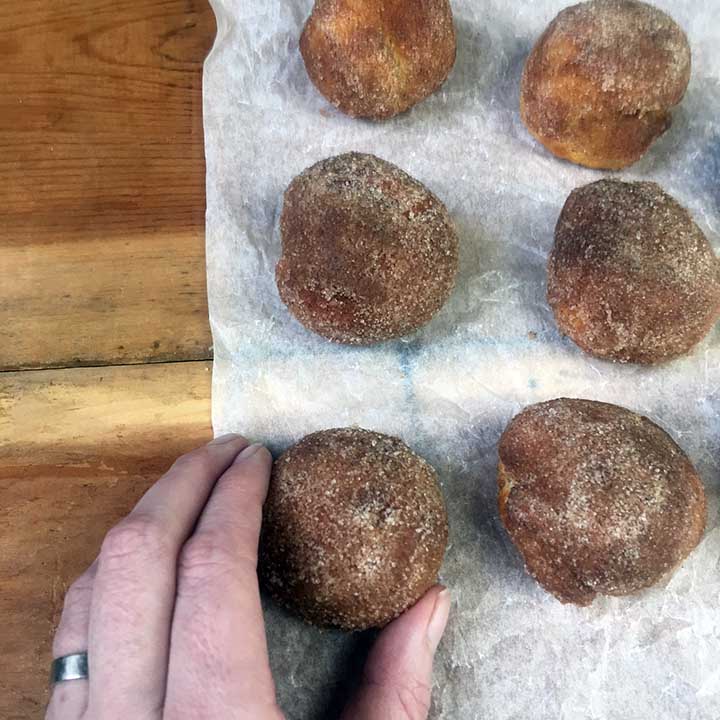 a hand holds a Keto Donut Hole