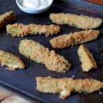 Keto fried pickles on a cookie sheet.