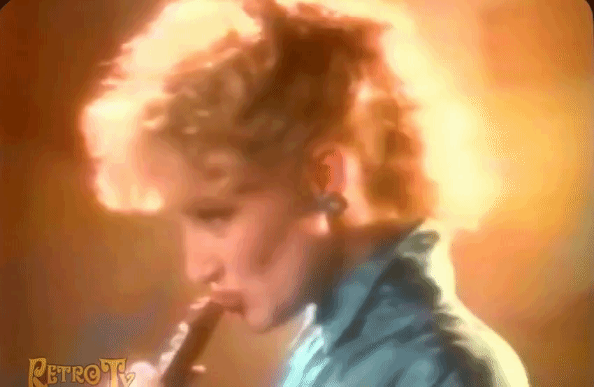Gif of a woman in a 1987 Snickers ad