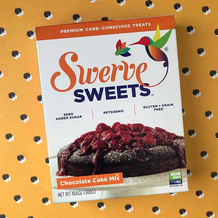 box of Swerve Sweets Chocolate Box Cake against a yellow patterned background