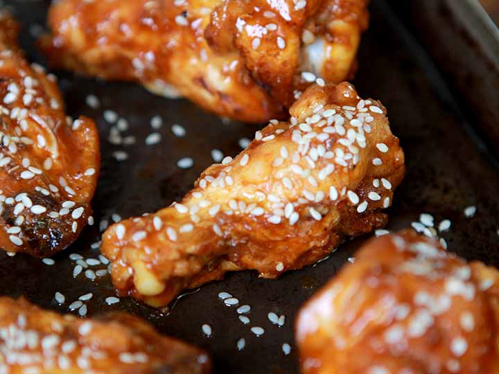 A close up of a Korean Chicken Wing Drumette