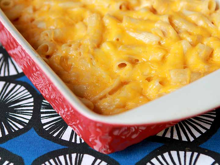red casserole dish holding low carb keto mac and cheese