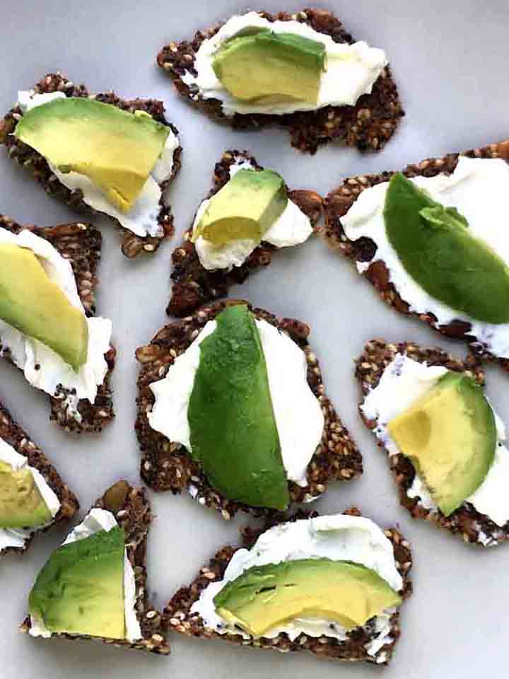 Close Up image of Low Carb Seed Crackers with cream cheese and avocado