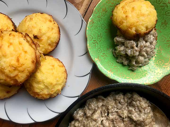 white and green plates holding Keto Biscuits and Gravy