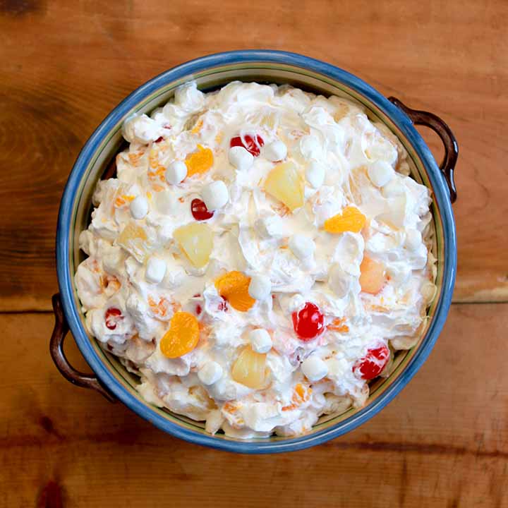 a top down view of a a large bowl of Ambrosia Salad with Cool Whip