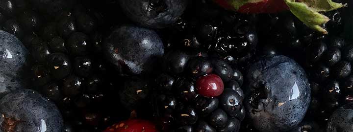close up image of strawberries, blueberries and blackberries