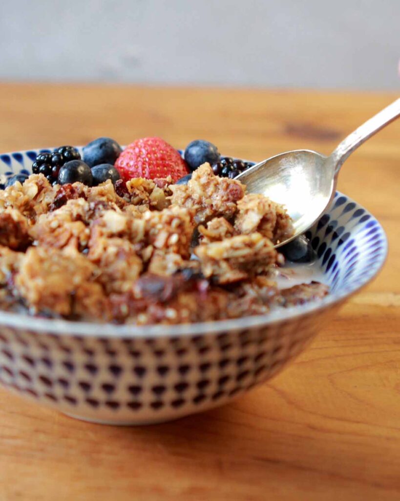 a spoon in a bowl of gluten-free granola