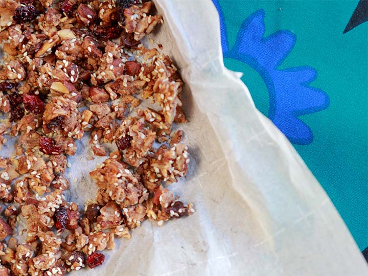 low carb ketogenic granola snack on a parchment paper covered cookie sheet