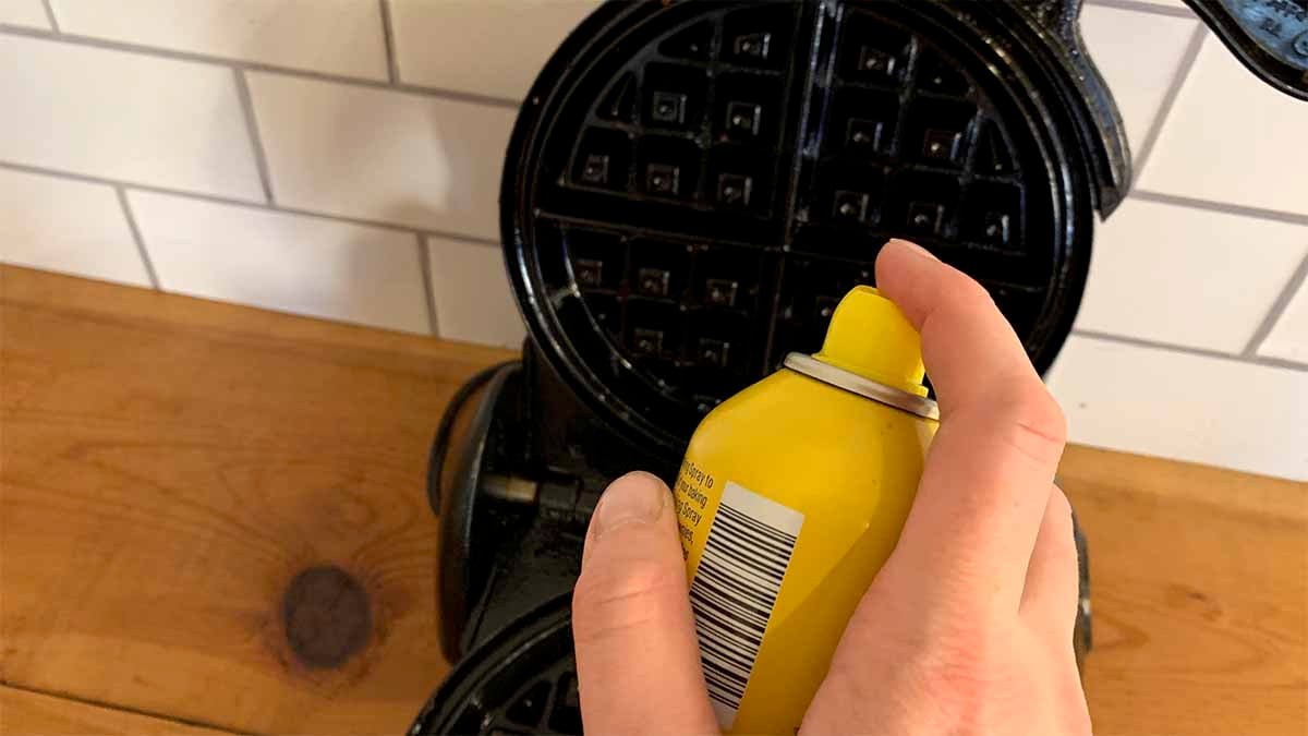 Spray the waffle iron with cooking spray.
