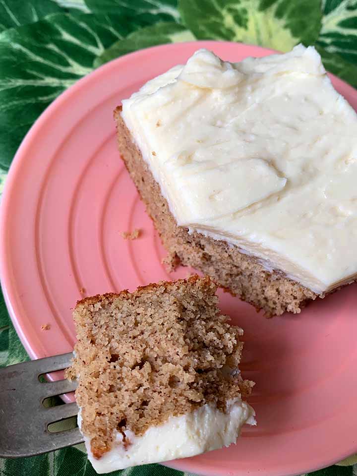 a fork holds a bite of Keto spice cake