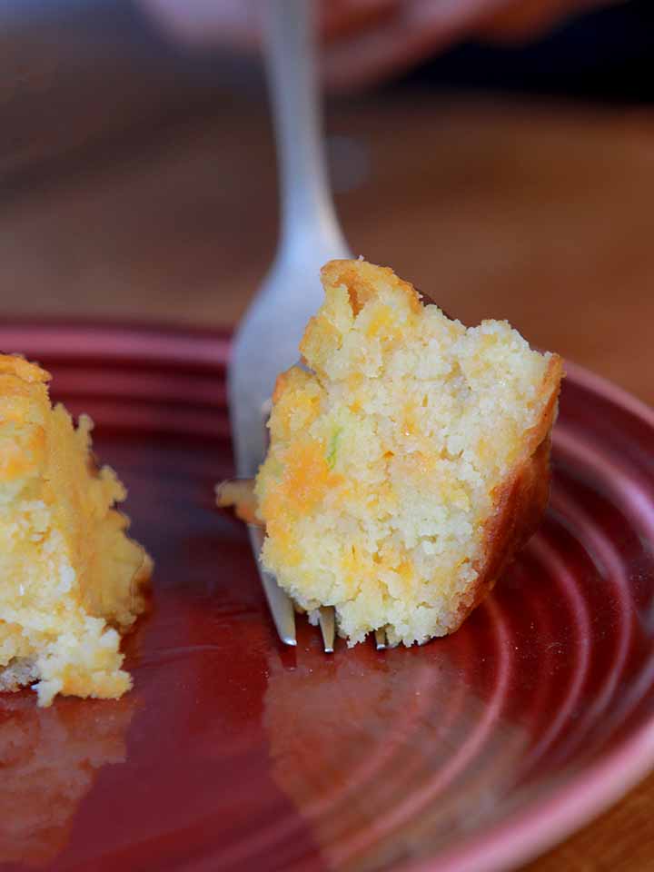 a fork hold a bite of low carb jalapeno cornbread