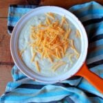 an orange pan containing Keto cheese grits