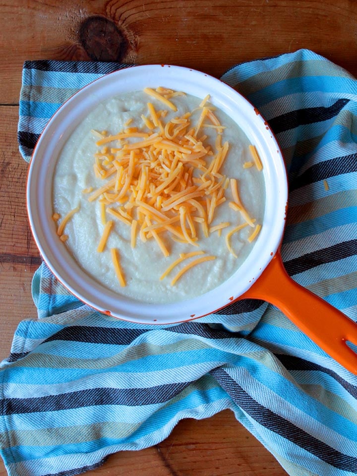 an orange pan containing Keto cheese grits