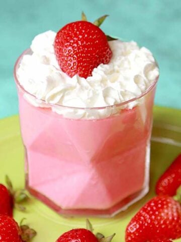 a glass filled with Keto Strawberries and Cream Jello Whips