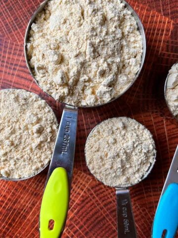 4 measuring cups filled with lupin flour