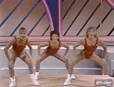 Gif of women in red work-out gear doing aerobics