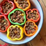 A top down view of a dutch oven filled with Keto stuffed peppers