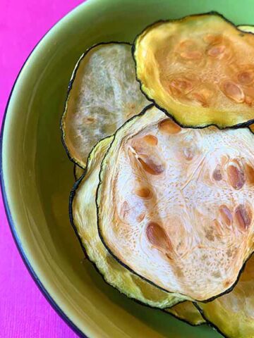 a bowl full of Crispy Keto Zucchini Chips