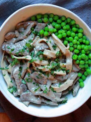 a bowl of Keto Beef Stroganoff with Green Peas