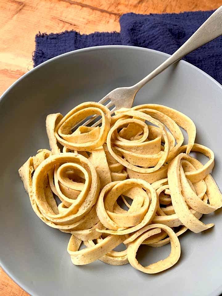 a fork in a gray bowl of easy Keto noodles